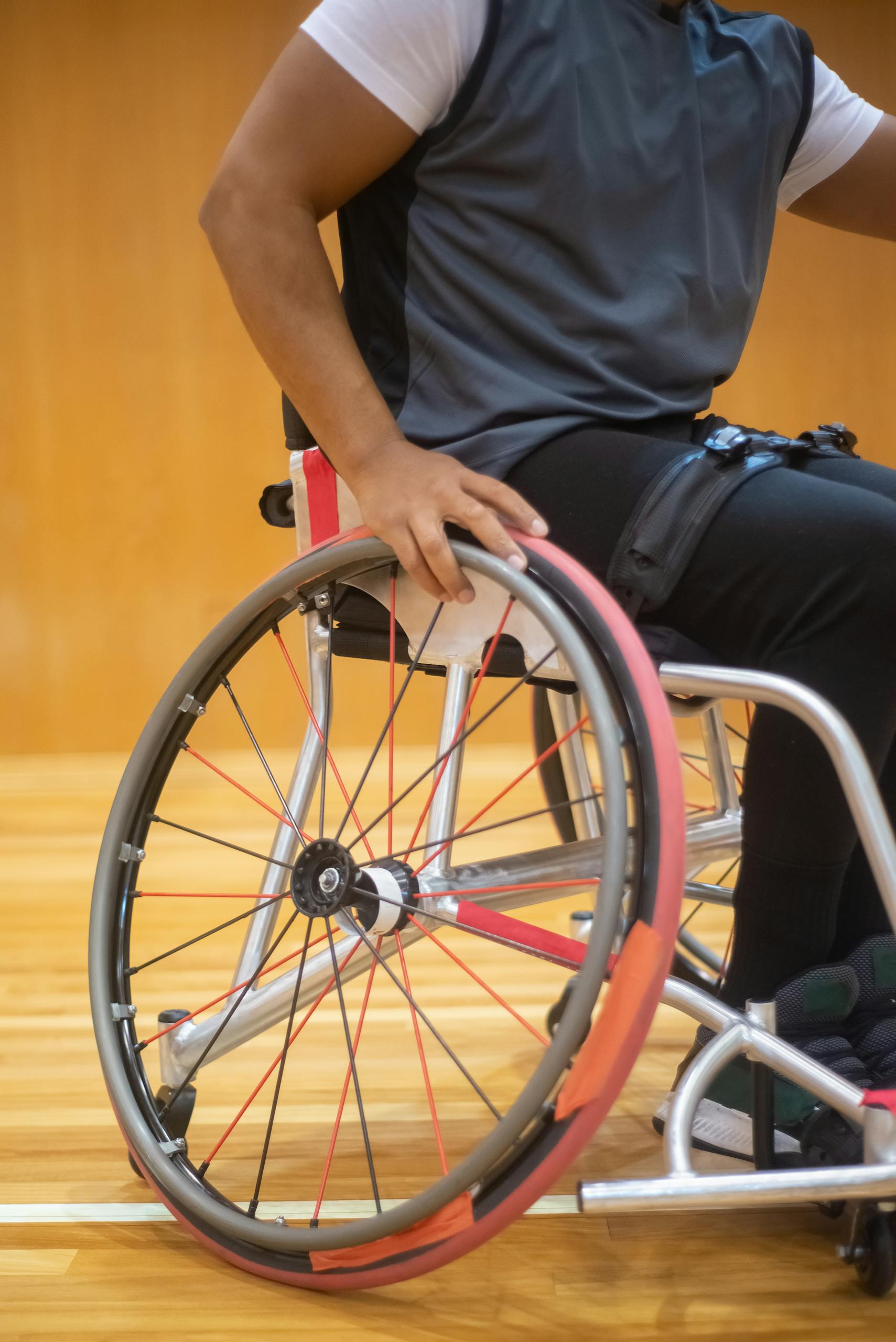 A wheelchair basketball player on an indoor court